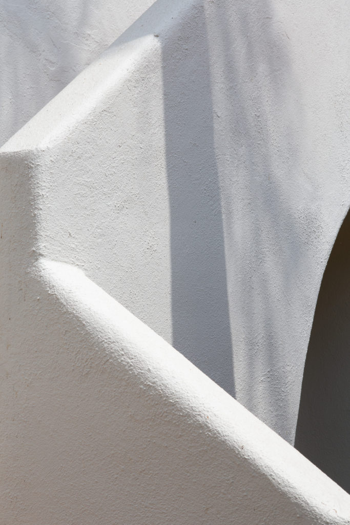 A photograph by the artist of a white plaster exterior staircase